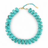 Turquoise beaded necklace with a gold clasp on a white background