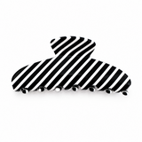 Black and white striped hair clip on a white background