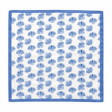 White fabric with blue shell pattern and blue border. Lightweight square scarf featuring an allover seashell print with a coordinating border, designed for versatile styling around the neck, hair, or handbag.