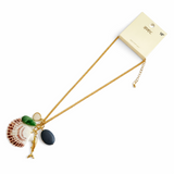 Necklace with seashell and fish charms on a white background