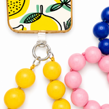 A phone connected to a colorful large beaded wrist lanyard