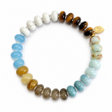 Vibrant beaded stretch bracelet featuring colorful glass beads with a playful mix of tones and textures. The Color Garden Stone Beaded Stretch Bracelet adds a cheerful touch to any outfit with its bright hues and comfortable elastic fit.