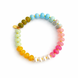 Vibrant beaded stretch bracelet featuring colorful glass beads with a playful mix of tones and textures. The Color Garden Stone Beaded Stretch Bracelet adds a cheerful touch to any outfit with its bright hues and comfortable elastic fit.
