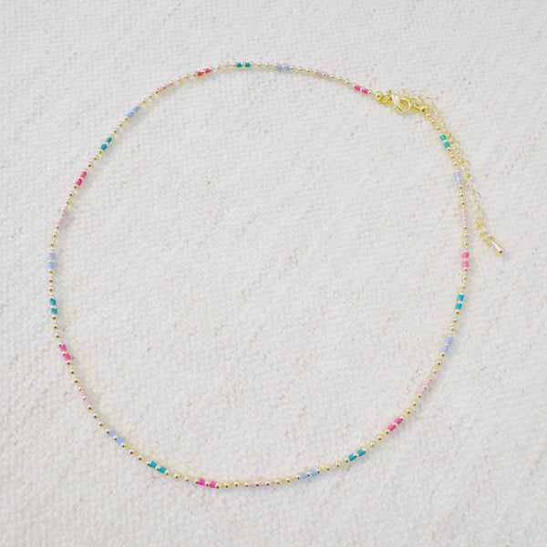 Delicate ball chain necklace featuring multicolor beads for a playful, vibrant look—perfect for layering or wearing solo to brighten up any outfit.