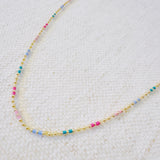Delicate ball chain necklace featuring multicolor beads for a playful, vibrant look—perfect for layering or wearing solo to brighten up any outfit.