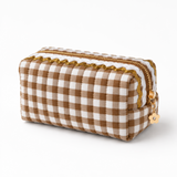 brown and white gingham fabric with colorful wavy details on top, white background