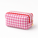 pink and white gingham fabric with colorful wavy details on top, white background