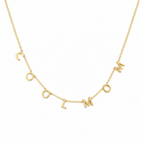 A gold chain necklace spelling out 'COOL MOM' in individual letter charms, displayed against a solid white background.