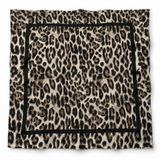 A square scarf featuring an all-over leopard print pattern in beige, brown, and black, finished with a solid black border.