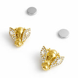 Gold-tone bee-shaped brooch or earrings with sparkling crystal-encrusted wings and a textured body, designed as a magnetic pin set for styling scarves or garments; comes in a set of two.