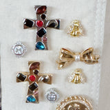 Gold-tone bee-shaped brooch or earrings with sparkling crystal-encrusted wings and a textured body, designed as a magnetic pin set for styling scarves or garments; comes in a set of two.