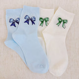 Set of two soft everyday socks featuring a delicate bow design, combining a touch of sweetness with cozy comfort for daily wear.