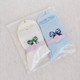 Set of two soft everyday socks featuring a delicate bow design, combining a touch of sweetness with cozy comfort for daily wear.