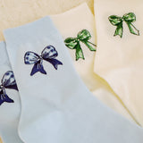 Set of two soft everyday socks featuring a delicate bow design, combining a touch of sweetness with cozy comfort for daily wear.