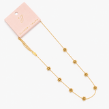 Gold necklace with floral pendants on a white background