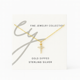 Delicate cross pendant necklace featuring shimmering cubic zirconia accents on a fine gold-tone chain, offering a subtle yet radiant touch for everyday elegance.