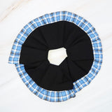 Chic hair scrunchie with a classic preppy design, featuring bold contrasting borders and a tailored look—perfect for polished, everyday styling