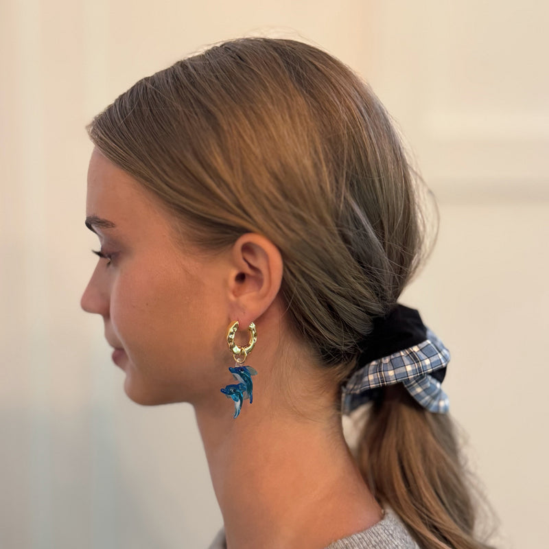 Chic hair scrunchie with a classic preppy design, featuring bold contrasting borders and a tailored look—perfect for polished, everyday styling