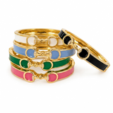 Set of colorful bangles with gold accents on a white background