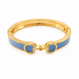 Gold bracelet with blue accents on a white background
