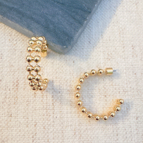 Gold-tone hoop earrings featuring a double layered ball chain design for a bold, textured look.