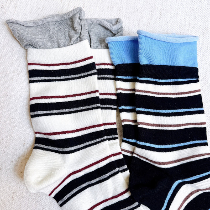 Bold and stylish set of two socks featuring edgy striped patterns and sassy color combinations—perfect for adding attitude and flair to any outfit.