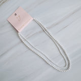 Set of two versatile pearl necklaces featuring luminous pearls in varying sizes, designed with magnetic clasps for easy wear and styling; can be worn individually or linked together for a longer layered look.