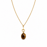 Equestrian bit design with brown tiger's eye stone oval pendant necklace on white background