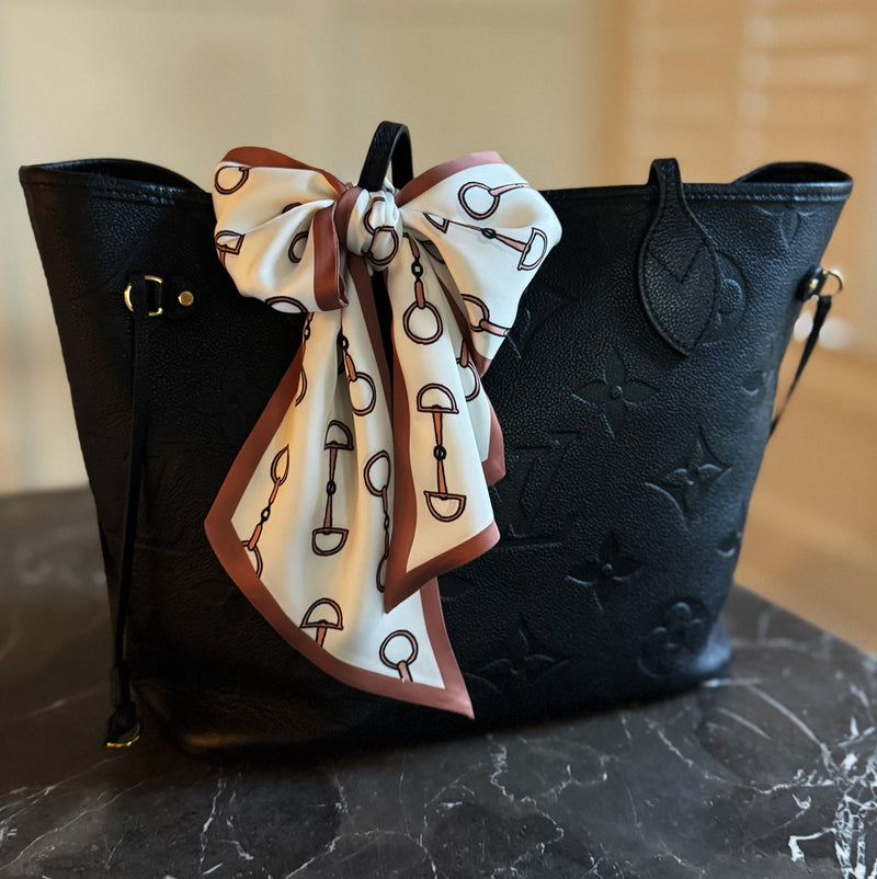 Scarf featuring an elegant equestrian-inspired chain link border design, ideal for accessorizing the neck, hair, or handbag handles.