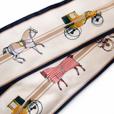 Silk scarf with horse and carriage design on a white background