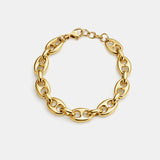 Gold-tone bracelet featuring a twisted, horse-bit-inspired design with interlocking links, offering an elegant equestrian flair and flexible fit.