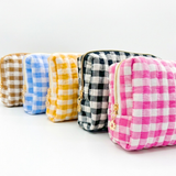 Five gingham-patterned pouches in different colors on a white background