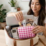 Woman organizing items in a pink checkered makeup bag with measurements indicated.