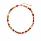 a necklace with different colors and shapes of beads in festive mood. white background