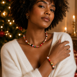 a woman wearing a necklace with different colors and shapes of beads in festive mood. wearing a matching bracelet. Holiday atmosphere.