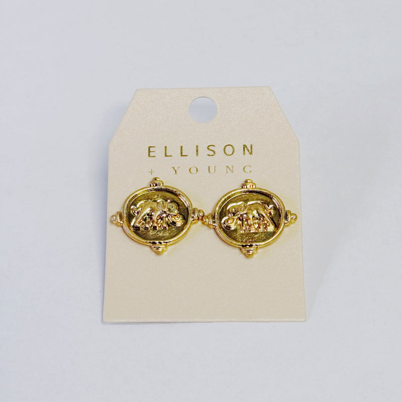 Gold round stud earrings featuring a raised fleur-de-lis design on a coin-style medallion with decorative beaded edges.