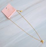 Gold-toned dual cross necklace featuring two layered cross pendants on a delicate chain for a bold, faith-inspired look