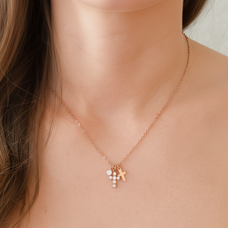 Gold-toned dual cross necklace featuring two layered cross pendants on a delicate chain for a bold, faith-inspired look