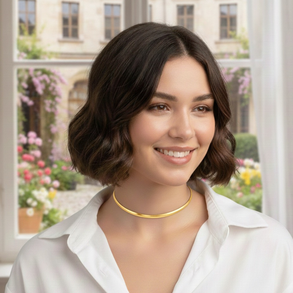 Gold-tone modern herringbone necklace featuring a sleek, flat chain design with subtle reflective shine and a secure clasp closure