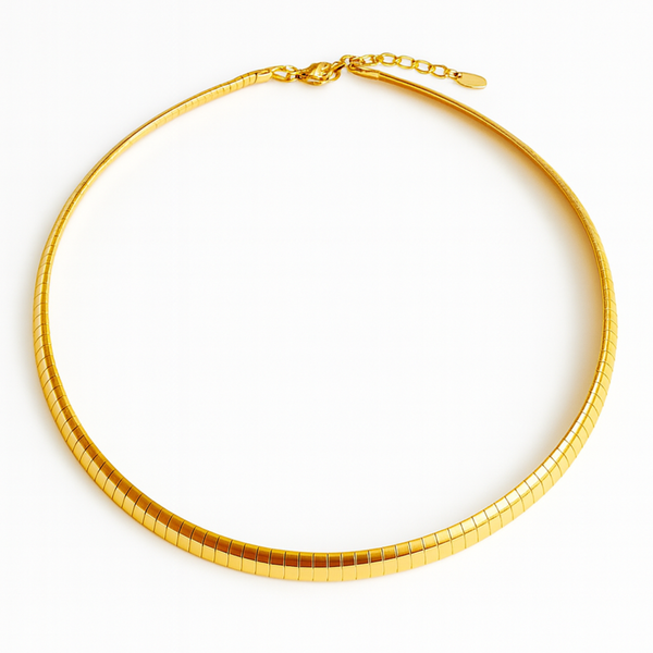 Gold-tone modern herringbone necklace featuring a sleek, flat chain design with subtle reflective shine and a secure clasp closure