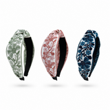 Three floral-patterned headbands on a white background