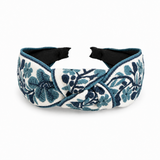 Decorative headband with blue floral pattern on a white background
