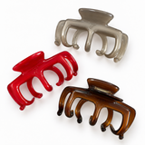 Three French Modern Acetate Claw Clips, large hold — platinum grey, rouge red, and espresso tortoiseshell — grouped together