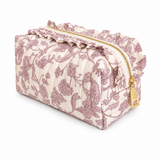 pink floral toile print cosmetic case with gold zipper ruffle top around zipper, white background