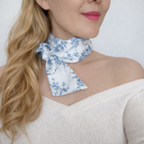 Elegant and versatile long silk hair scarf featuring a classic French toile pattern. The French Toile Sleek and Long Hair Scarf adds a touch of Parisian charm, perfect for tying around a ponytail, wrapping around a bun, or styling as a headband.
