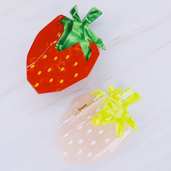 Cute and colorful strawberry-shaped hair claw clip with a glossy finish, perfect for adding a fresh and playful touch to any hairstyle.