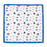Napkin with sea-themed pattern featuring stars, shells, and fish on a white background