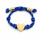 a navy blue rope bracelet with gold heart charm on the white background