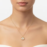 Gold chain necklace featuring a cushion-cut clear crystal pendant with a textured gold bezel, radiating timeless shine and elegance.