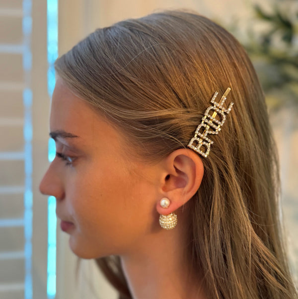 Elegant set of two gold and silver hair pins featuring sparkling "Bride" lettering and glam crystal accents—perfect for bridal showers, bachelorette parties, or wedding day styling.